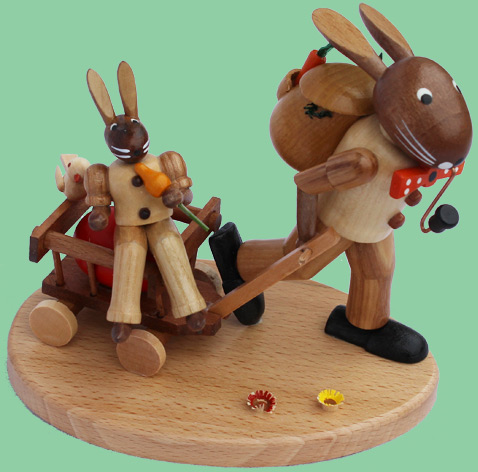 Hasenfamilie mit Handwagen